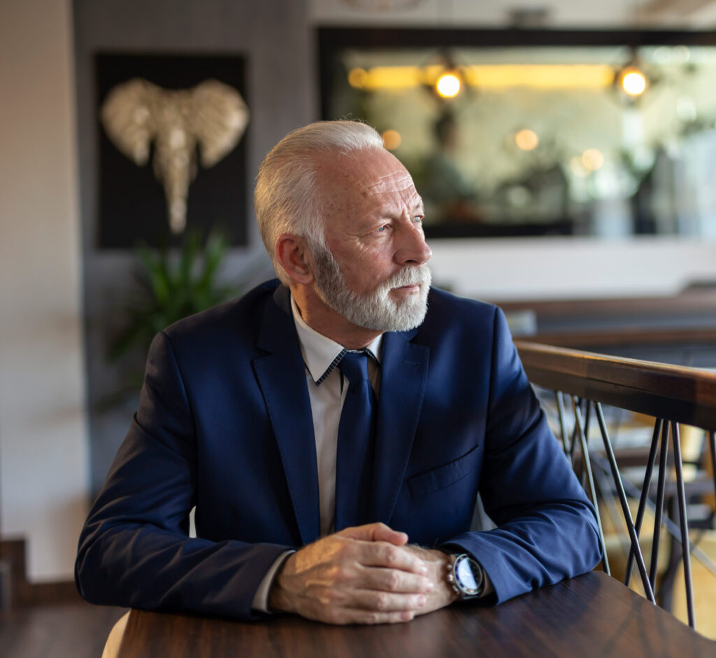 Pensive senior businessman in restaurant